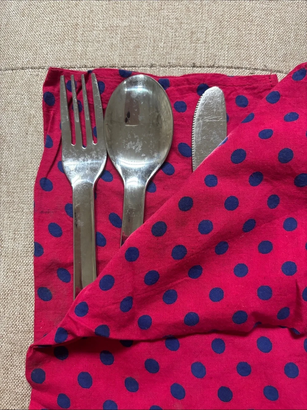 Stainless steel set(fork, spoon, knife) and napkin.